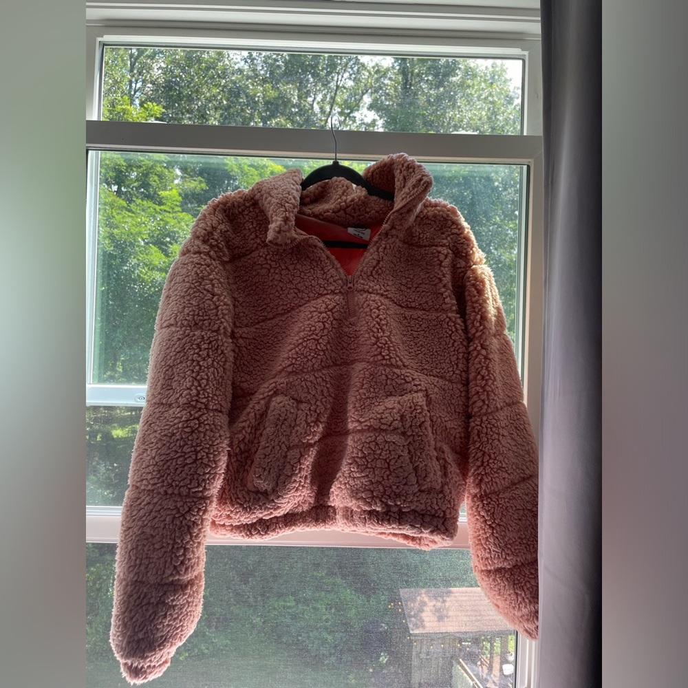 Pink sweater. Warm and fluffy on the outside and silky inside.